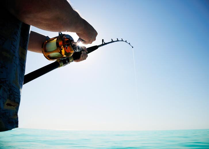 A person holding a fishing rod